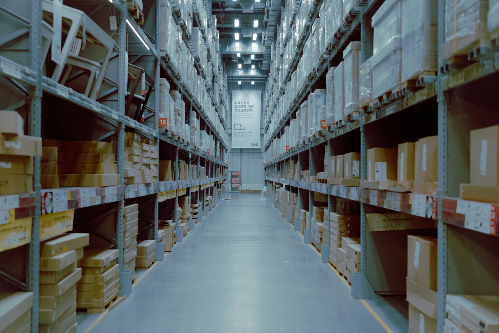 Warehouse aisle with stocked pallet racking